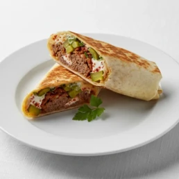 Sujuk lamb wrap with garlic sauce, fenugreek, spices, and pickles – authentic Middle Eastern street food at Utopia Mercato London